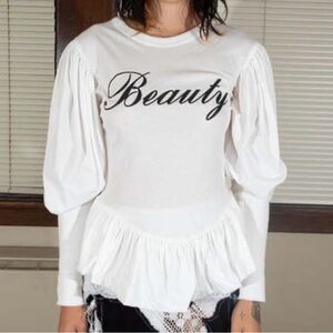 Elegant White Long Sleeve Top with 'Beauty' Script